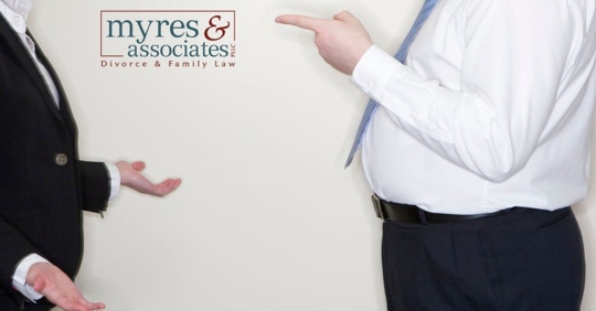 Man pointing finger at another person.