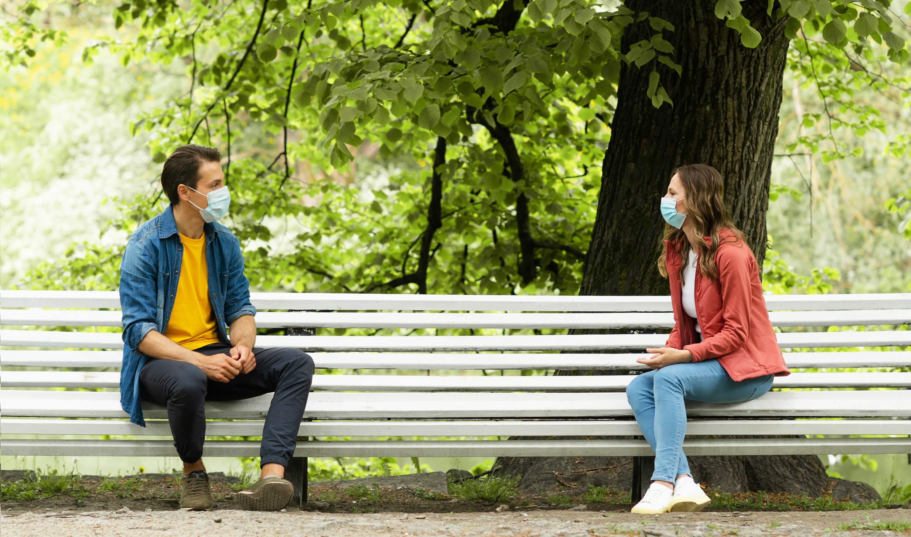 two people talking with mask